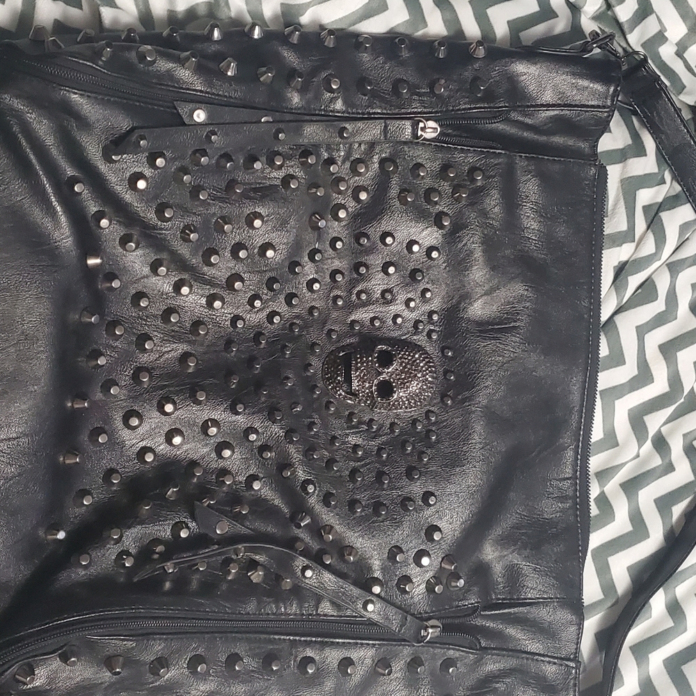 Very large black studs & skulls bag